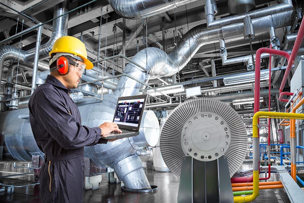 engineer using laptop computer maintenance thermal power plant industrail