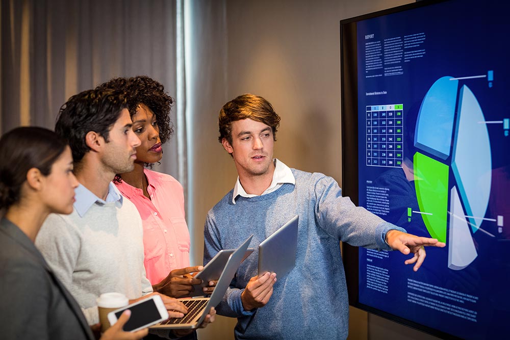 business people having discussion graph conference room